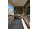 Cozy porch with a stone accent wall and plenty of natural light at 13788 Umatilla Ln, Broomfield, CO 80023