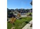 A residential street with well-maintained lawns and sidewalks is seen at 13788 Umatilla Ln, Broomfield, CO 80023