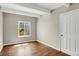 Bedroom featuring a window with natural light and wood floors at 9995 E Harvard Ave # 290, Denver, CO 80231