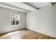 Bedroom featuring a window with natural light and wood floors at 9995 E Harvard Ave # 290, Denver, CO 80231