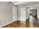 Hallway view showing the unit's doors and an overview of the flooring and room flow at 9995 E Harvard Ave # 290, Denver, CO 80231