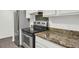 Efficient kitchen layout with stainless steel oven and neutral countertops at 9995 E Harvard Ave # 290, Denver, CO 80231