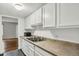 Functional kitchen space with a double sink and views into the connected living area at 9995 E Harvard Ave # 290, Denver, CO 80231
