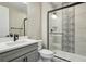 Stylish bathroom featuring a modern vanity and walk-in shower with decorative tiles at 1660 Candleflower Dr, Castle Pines, CO 80108