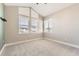 Bright bedroom with a vaulted ceiling and multiple windows providing ample natural light at 1660 Candleflower Dr, Castle Pines, CO 80108