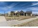 Community clubhouse with bike racks, modern architecture, and inviting landscape at 1660 Candleflower Dr, Castle Pines, CO 80108