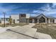 Beautiful Canyon House exterior showcasing stone and wood finishes, and inviting entryway at 1660 Candleflower Dr, Castle Pines, CO 80108