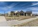 Stunning exterior of the Canyon House with modern architectural design and attractive landscaping at 1660 Candleflower Dr, Castle Pines, CO 80108