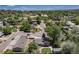 Community aerial showing tree-lined streets, and nearby green spaces at 8712 W 64Th Way, Arvada, CO 80004