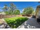 Spacious backyard featuring a lush lawn, wood fence, and an inviting outdoor space, perfect for relaxing at 8712 W 64Th Way, Arvada, CO 80004