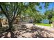 Backyard featuring a patio, shed, grass, firepit and mature trees for outdoor living and entertaining at 8712 W 64Th Way, Arvada, CO 80004