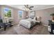 Cozy bedroom featuring natural light, a comfortable bed, and a calm and neutral color scheme at 8712 W 64Th Way, Arvada, CO 80004