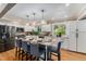 Modern kitchen with granite countertops, stainless steel appliances, and an island with bar stool seating at 8712 W 64Th Way, Arvada, CO 80004