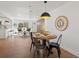 Bright dining area showcasing a round table with modern decor and open layout at 4947 Saint Paul St, Denver, CO 80216