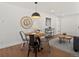 Charming dining area with an elegant round table and cozy seating at 4947 Saint Paul St, Denver, CO 80216