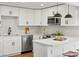 Well-equipped kitchen featuring stainless steel appliances and a modern design at 4947 Saint Paul St, Denver, CO 80216