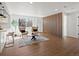 Inviting living room featuring stylish decor, wood flooring, and plenty of natural light at 4947 Saint Paul St, Denver, CO 80216