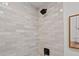 The tile in the shower is very stylish and modern at 4947 Saint Paul St, Denver, CO 80216