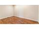 Spacious basement room with wood flooring and neutral walls at 7242 E 133Rd Cir, Thornton, CO 80602