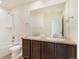 Bathroom with double vanity, granite countertop, and a bathtub at 7242 E 133Rd Cir, Thornton, CO 80602