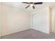 Bedroom with ceiling fan, carpet, and double doors to closet at 7242 E 133Rd Cir, Thornton, CO 80602