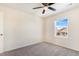 Bedroom with ceiling fan, window, and carpet flooring at 7242 E 133Rd Cir, Thornton, CO 80602