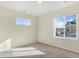 Bedroom with two windows, carpet, and neutral walls at 7242 E 133Rd Cir, Thornton, CO 80602