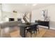 Dining area with wood floors and modern furniture at 7242 E 133Rd Cir, Thornton, CO 80602