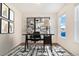 Home office featuring a desk, shelving, and large window at 7242 E 133Rd Cir, Thornton, CO 80602