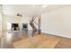 Living room with fireplace, wood floors and large windows at 7242 E 133Rd Cir, Thornton, CO 80602