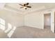 Main bedroom with carpet flooring, ceiling fan, and multiple windows at 7242 E 133Rd Cir, Thornton, CO 80602