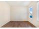 Empty spare bedroom with wood floors and a window at 7242 E 133Rd Cir, Thornton, CO 80602