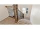 Wooden staircase with black metal railings leading to the upper level at 7242 E 133Rd Cir, Thornton, CO 80602