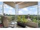 Relaxing balcony with ornate ironwork, potted plants, and city views at 1200 N Humboldt St # 1406, Denver, CO 80218