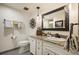 Stylish bathroom with granite vanity, decorative mirror, and modern fixtures at 1200 N Humboldt St # 1406, Denver, CO 80218