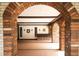 Arched brick entrance leading into a well-maintained lobby area at 1200 N Humboldt St # 1406, Denver, CO 80218