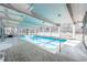 Bright indoor pool with seating area surrounded by large windows at 1200 N Humboldt St # 1406, Denver, CO 80218