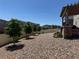 Low-maintenance backyard with attractive rock landscaping, privacy fence, pergola and patio at 12768 Trejo Cir, Parker, CO 80134