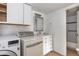 Bright laundry room and bathroom combination with modern fixtures at 9995 E Harvard Ave # 257, Denver, CO 80231