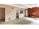 Living room leading into the kitchen with a serving hatch at 9995 E Harvard Ave # 257, Denver, CO 80231