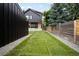 Spacious backyard with lush green grass, modern shed and well-kept fence at 863 S Race St, Denver, CO 80209
