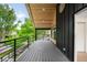 Outdoor balcony with wood ceiling and sleek railing, perfect for enjoying city views at 863 S Race St, Denver, CO 80209