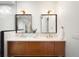 Modern bathroom featuring a double vanity with wood cabinets, white countertops, and stylish lighting fixtures at 863 S Race St, Denver, CO 80209