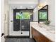 Sleek bathroom with a glass-enclosed shower, dual shower heads and stylish vanity at 863 S Race St, Denver, CO 80209