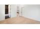 Bright bedroom with hardwood floors leading to a modern bathroom and closet space at 863 S Race St, Denver, CO 80209