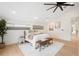 Spacious bedroom with natural light, hardwood floors, and a cozy bench at 863 S Race St, Denver, CO 80209