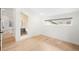 Clean, open bedroom space with hardwood floors and an ensuite bathroom, offering modern comfort at 863 S Race St, Denver, CO 80209