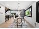 Elegant dining area featuring modern decor, contemporary lighting and view to the kitchen at 863 S Race St, Denver, CO 80209