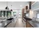 Modern kitchen with stainless steel appliances, breakfast bar, and hardwood floors at 863 S Race St, Denver, CO 80209