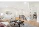 Cozy living room with neutral tones, modern decor, view of the staircase, and a laundry room at 863 S Race St, Denver, CO 80209